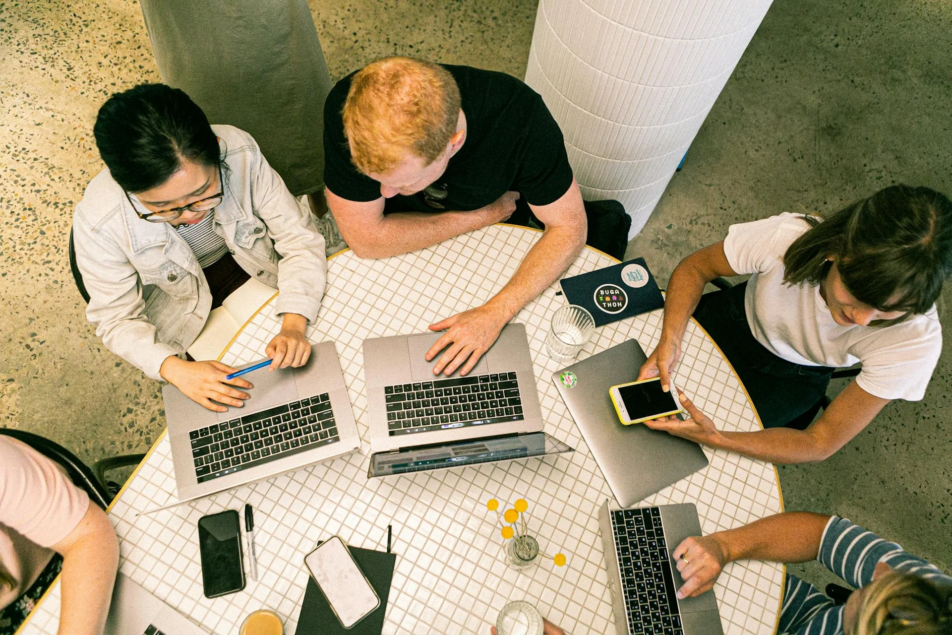 A group of digital marketing professionals hanging around a table 