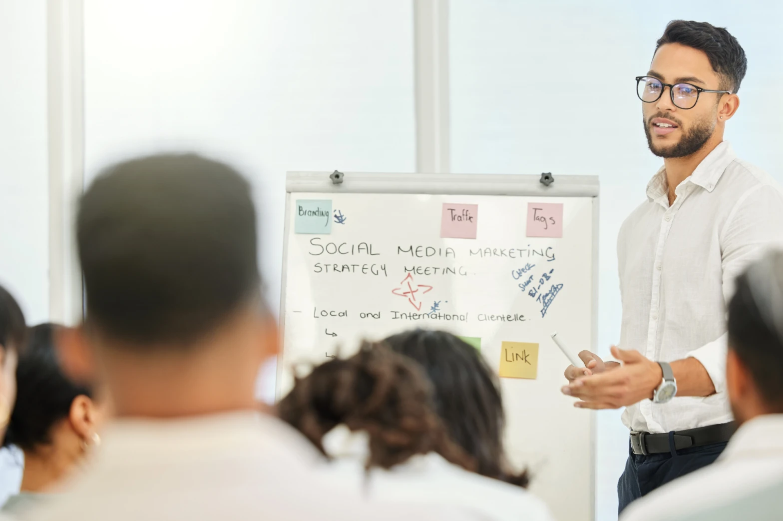 A social media marketing manager leading a strategy meeting
