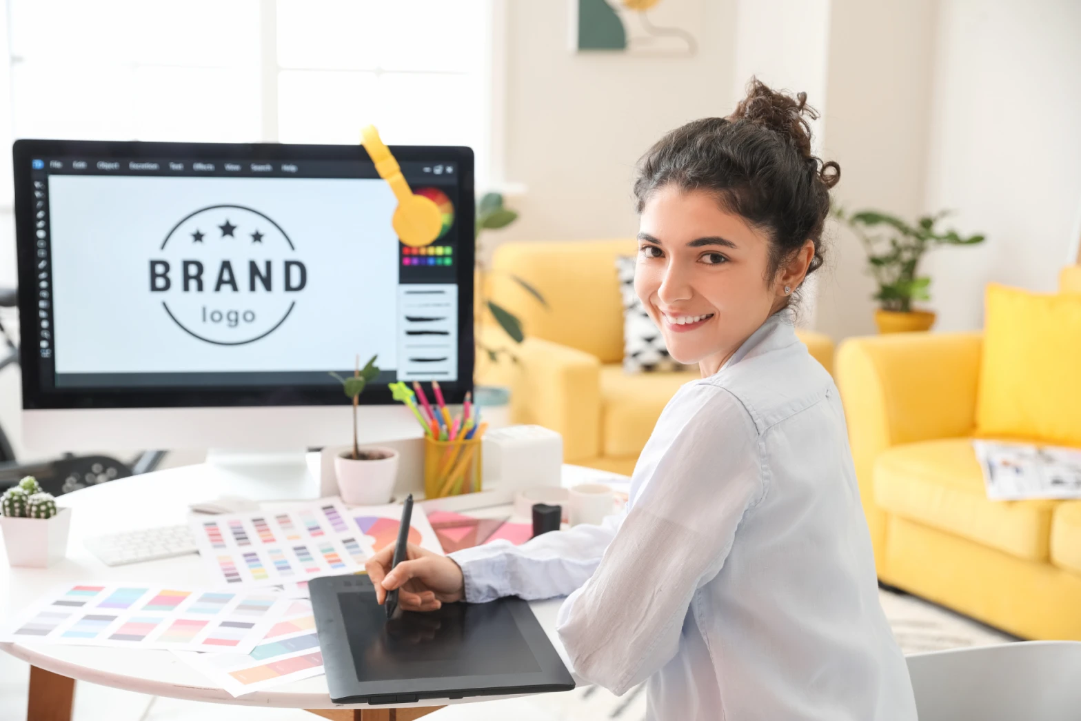 A graphic designer working on a brand logo