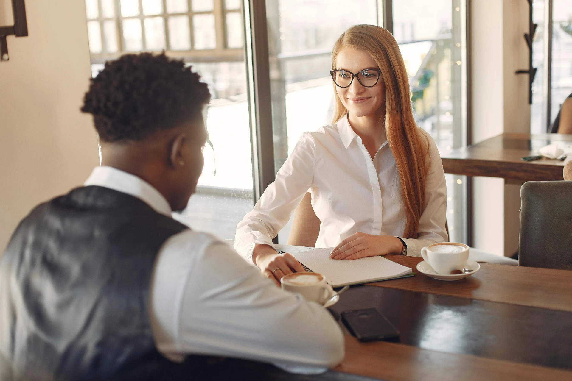 Recruiter interviewing a candidate in a stylish office setting