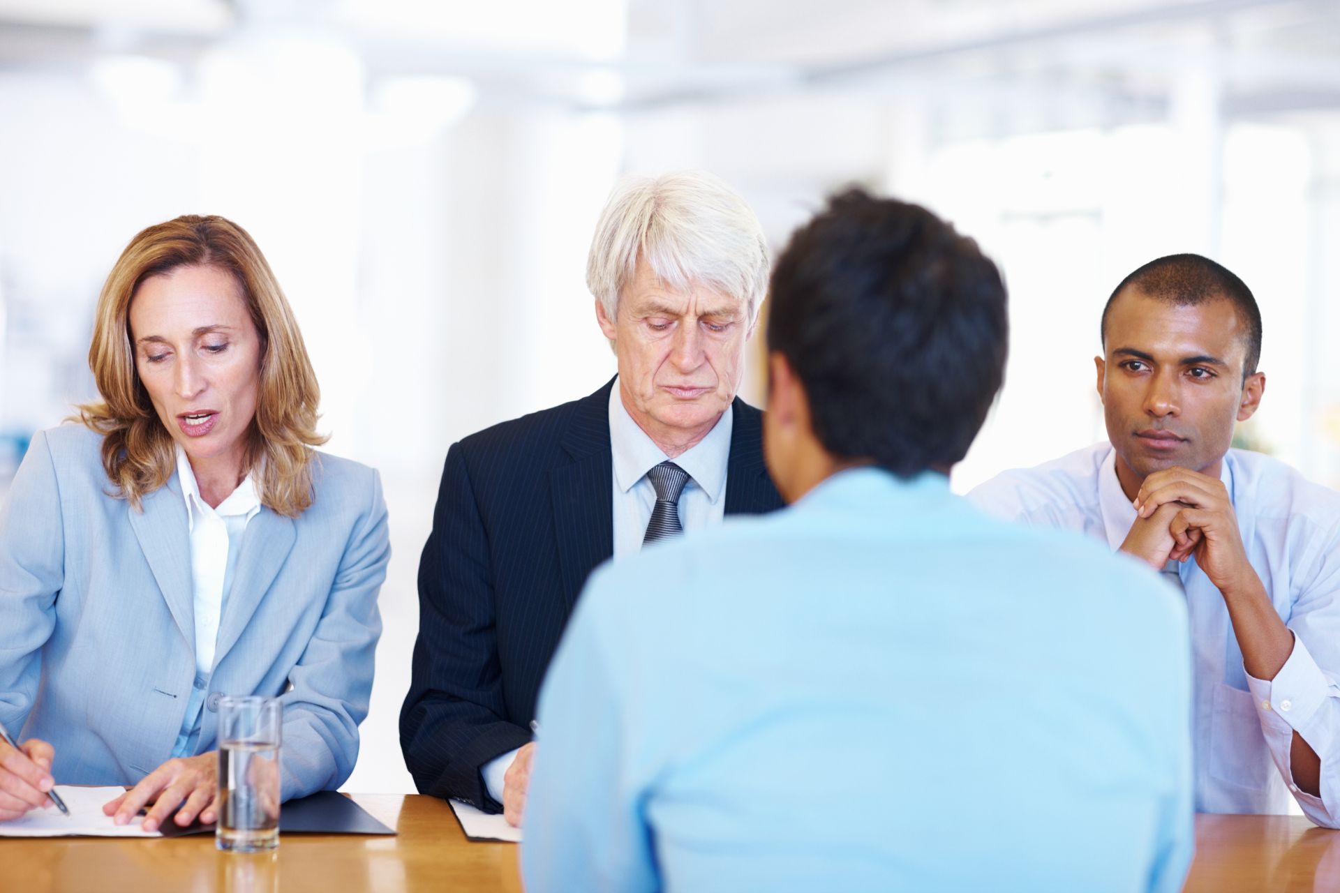 A panel of interviewers assessing a candidate