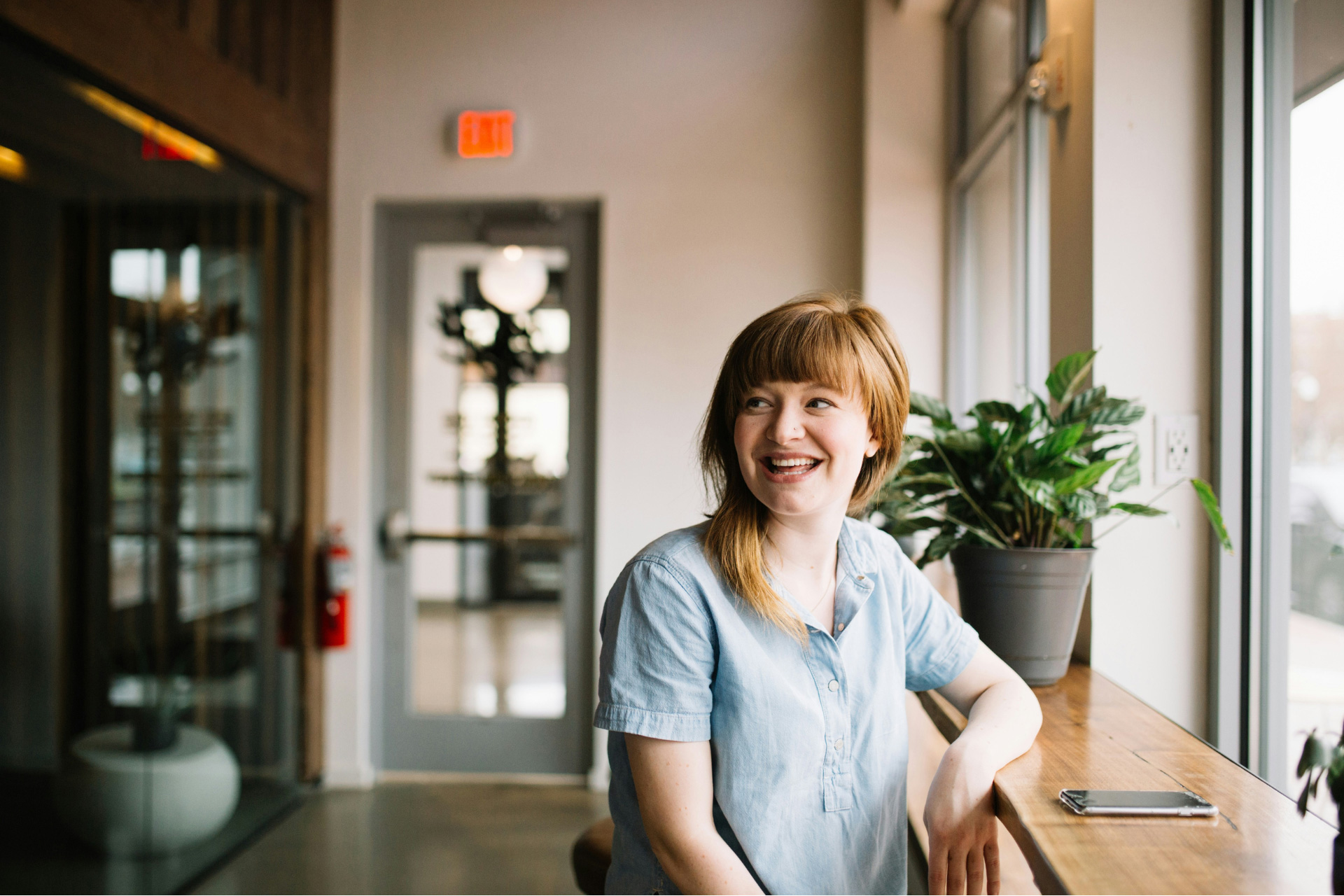 A smiling woman sitting in her workplace 