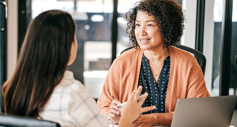 Two female professionals have a meeting or interview
