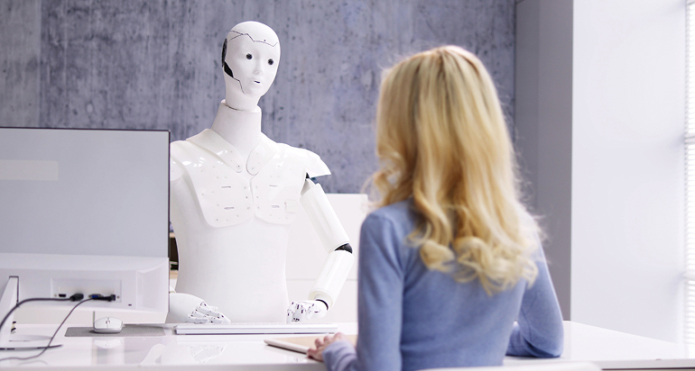 Robot interviewing a candidate in an office