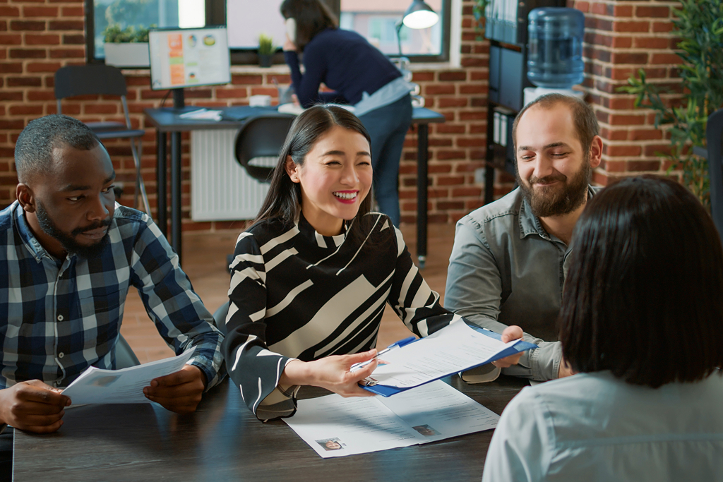 Three HR leaders interviewing a candidate 