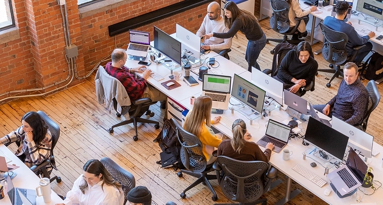 Employees busy at work in an office.
