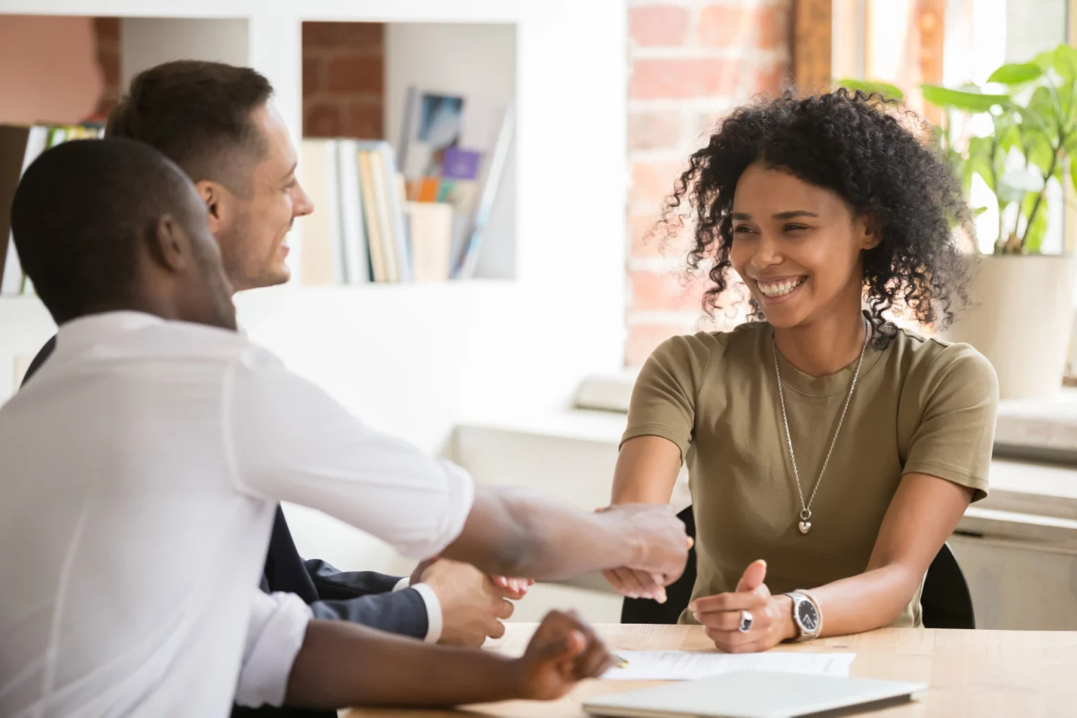 Gen Z talent shaking hands with employers