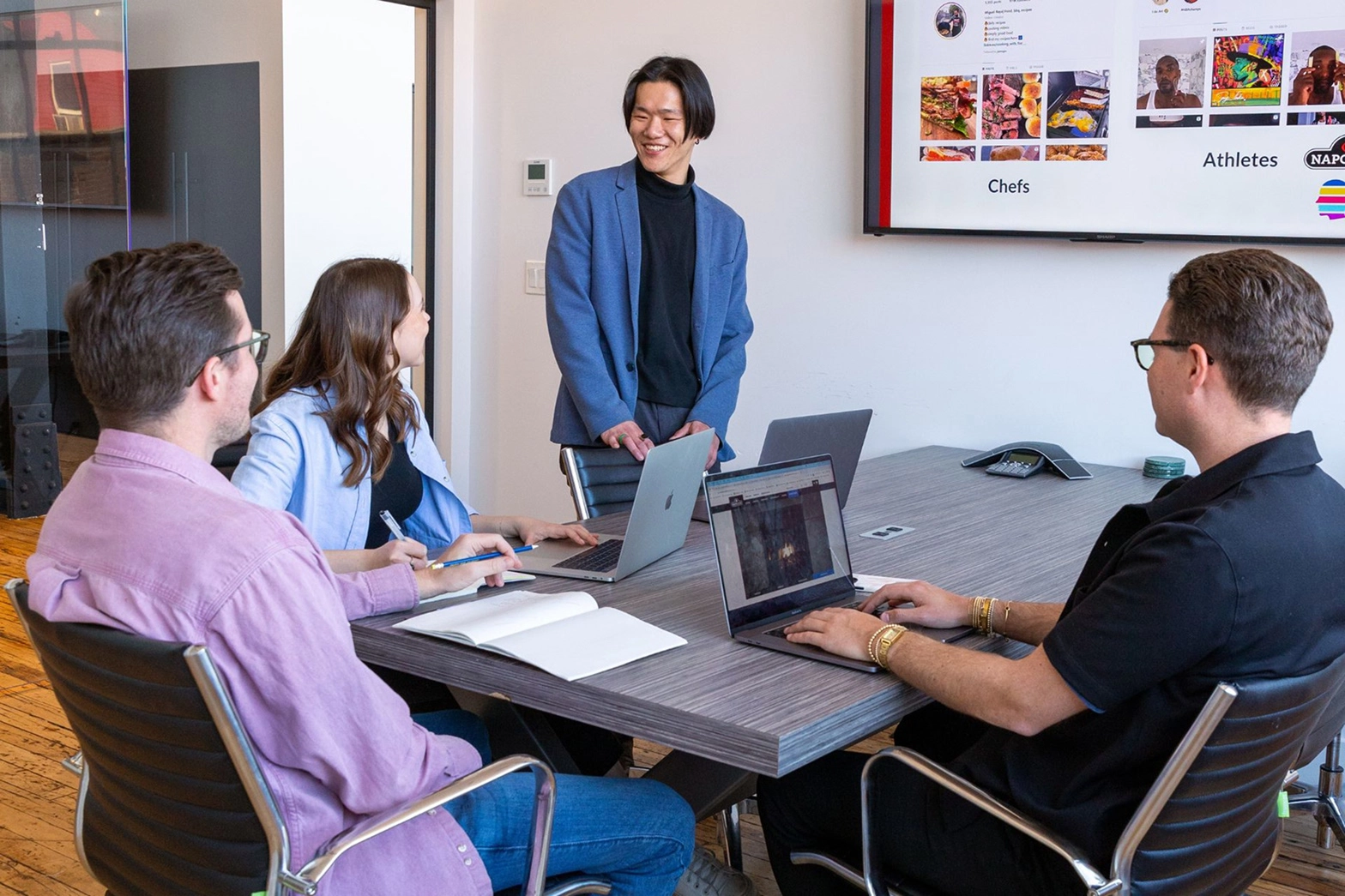 Coworkers of different ages and genders in one room