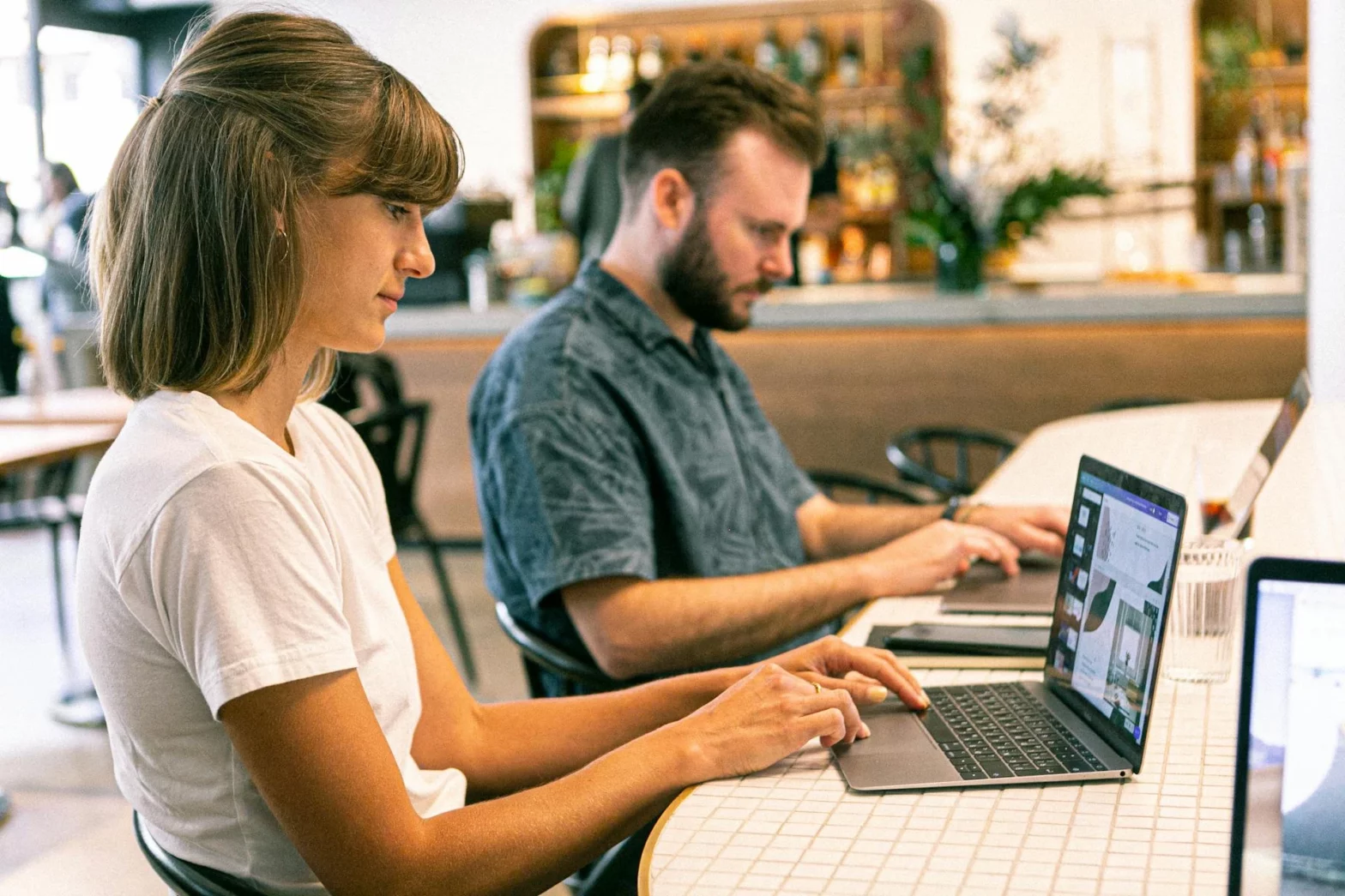 Male and female workers sitting beside each other