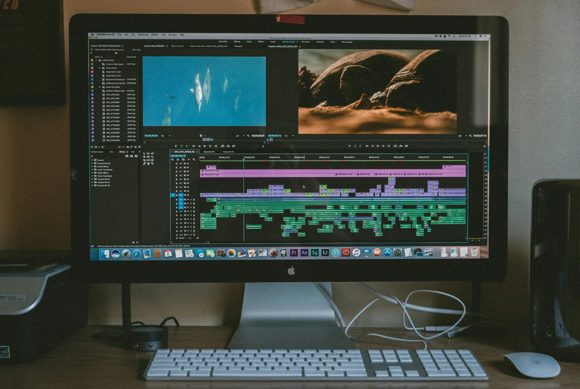 A videographer using Adobe Premiere Pro 